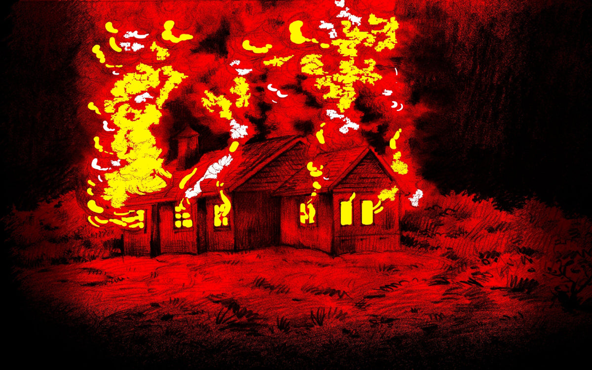 Small house burning in bright flames at night, the fire that destroyed the house on the empty lot next door.