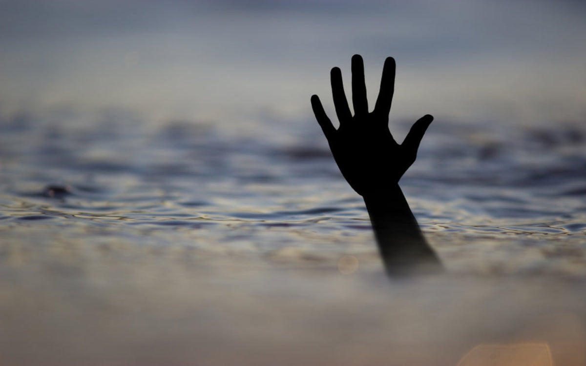 A drowning victim reaching from the water, representing those killed by Candle Face.